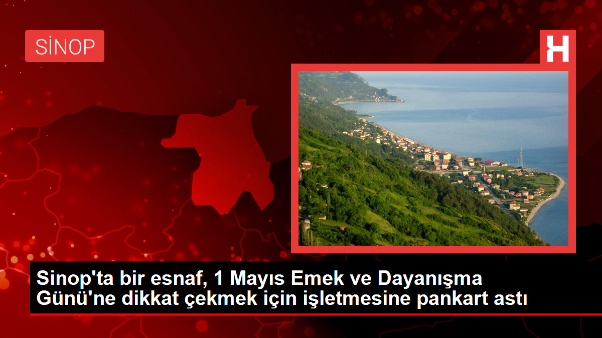 Sinop'ta bir esnaf, 1 Mayıs Emek ve Dayanışma Günü'ne dikkat çekmek için işletmesine pankart astı