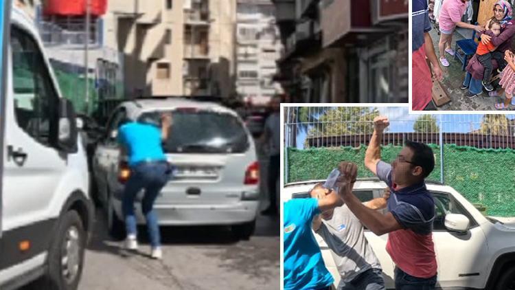 İzmir'de trafiğe engel oldu! Önce otomobilin camını kırdı sonra baygınlık geçirdi